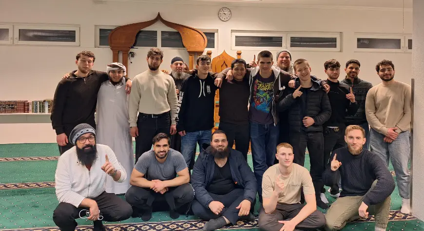 Group of young men gathered inside a mosque in Norway for a Dawah event.